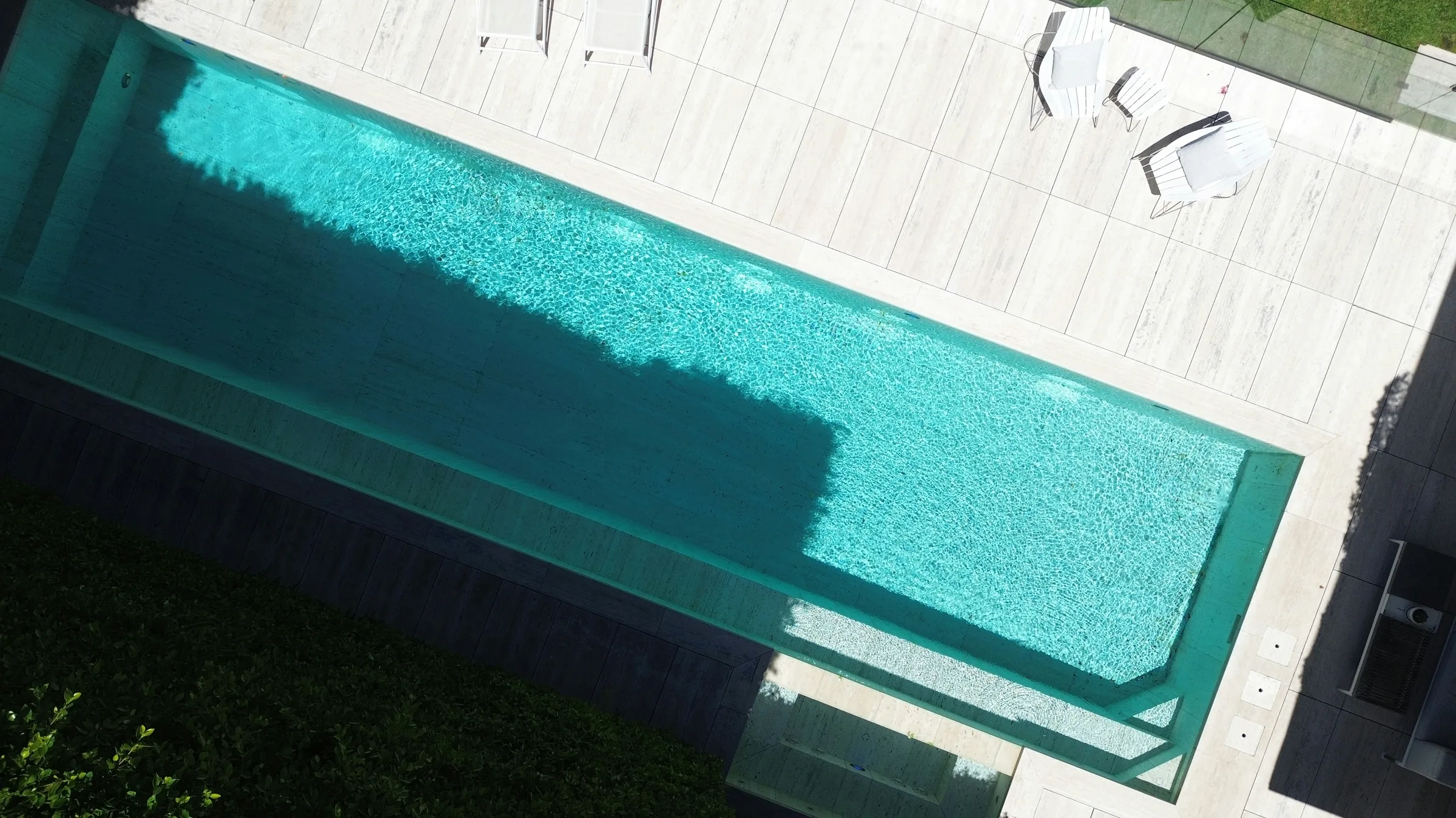 Modern rectangular pool and patio seen from above